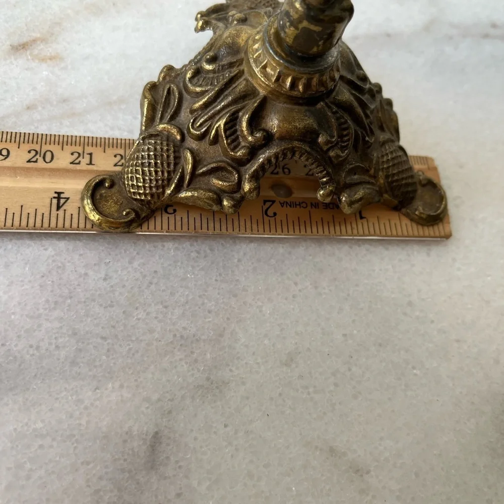 Antique cherub figurine candle holder